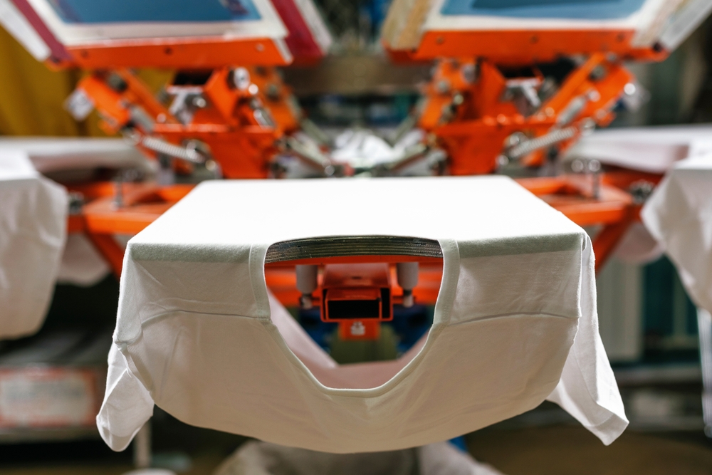 White,t Shirts,on,a,print,screening,apparatus.,silk,screen,printing.